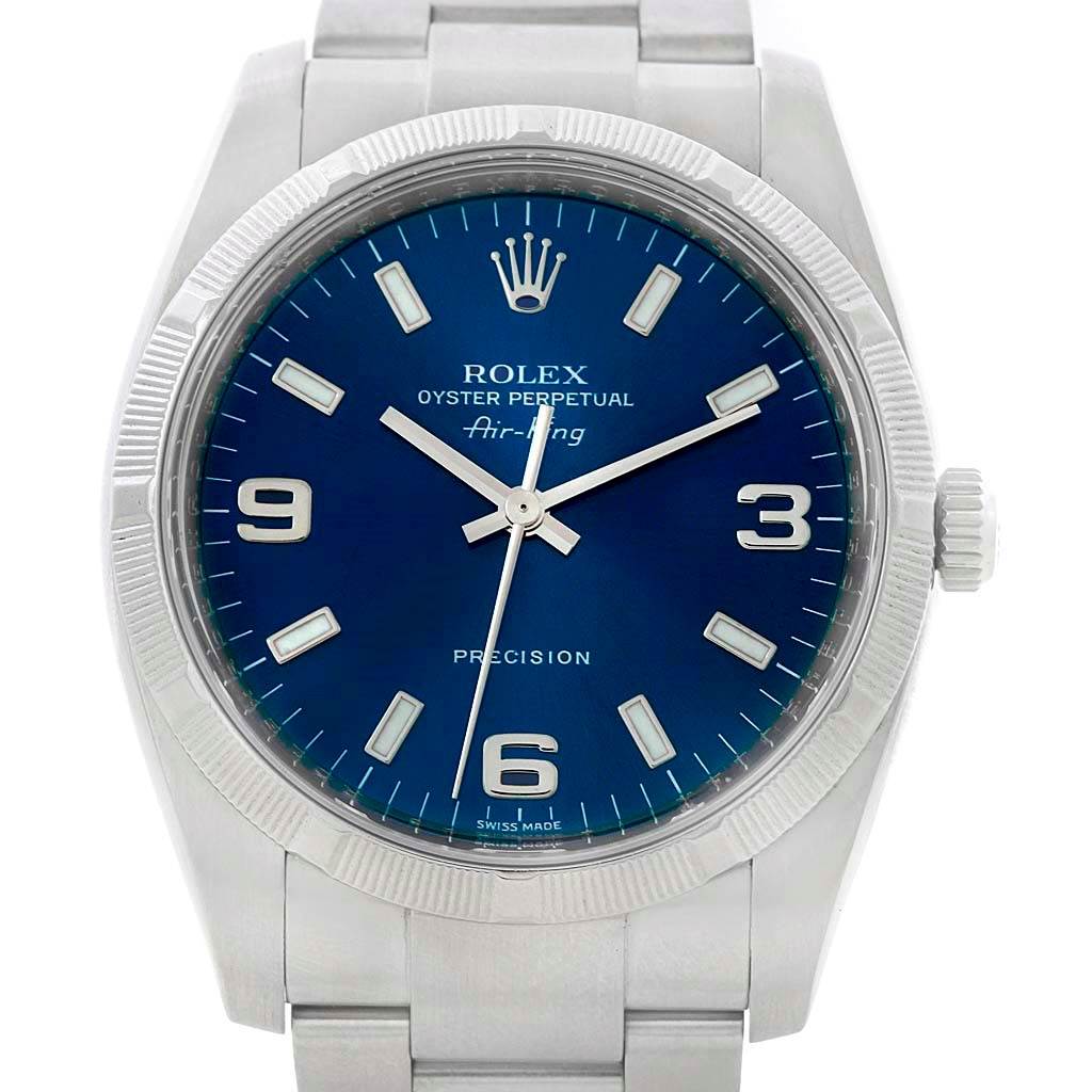 This image shows a Rolex Air-King 114210 Men's Stainless Steel Blue Dial 114210 Men's Stainless Steel Blue Dial watch from a front angle, highlighting its blue dial, hour markers, and stainless steel bracelet.