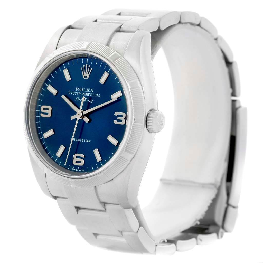 The Rolex Air-King 114210 Men's Stainless Steel Blue Dial 114210 Men's Stainless Steel Blue Dial watch is shown at a three-quarter angle, displaying its blue dial, crown, and stainless steel bracelet.