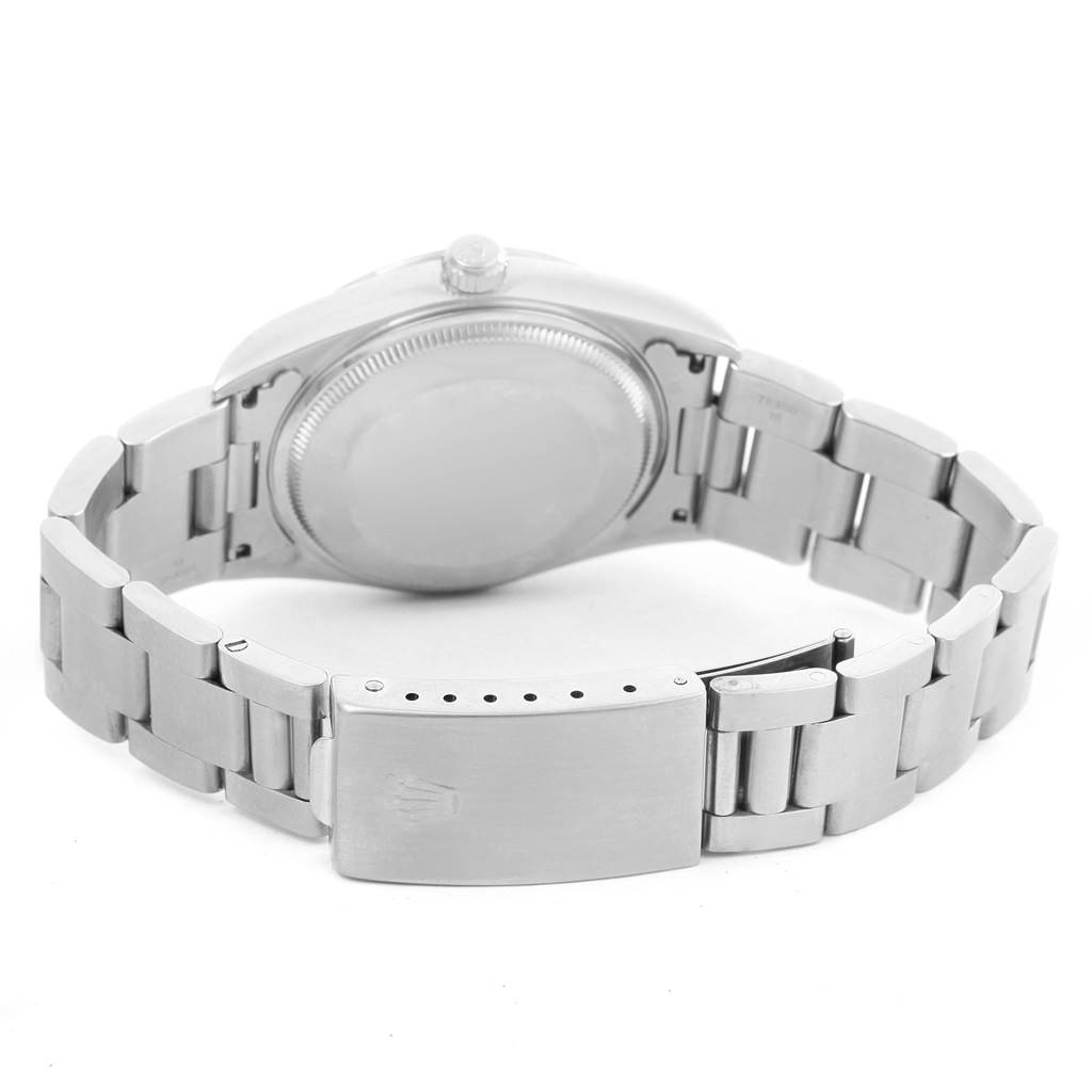 The image shows the backside and the bracelet clasp of the Rolex Air-King 14000 Women's Stainless Steel Blue Dial 14000 Women's Stainless Steel Blue Dial watch, displaying its stainless steel construction.