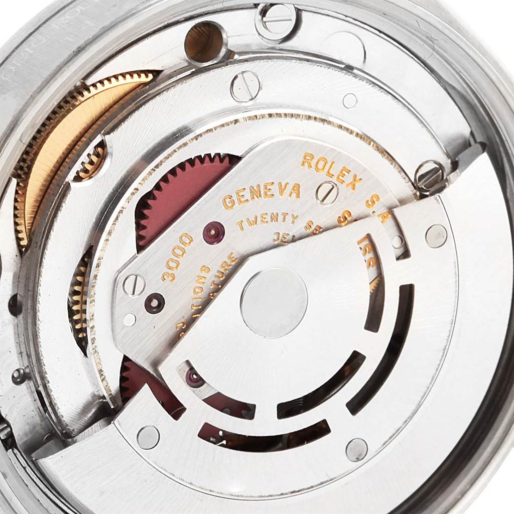 The image shows a close-up of the movement mechanism inside a Rolex Air-King 14000 Women's Stainless Steel Blue Dial 14000 Women's Stainless Steel Blue Dial watch, revealing gears and the engraved text.
