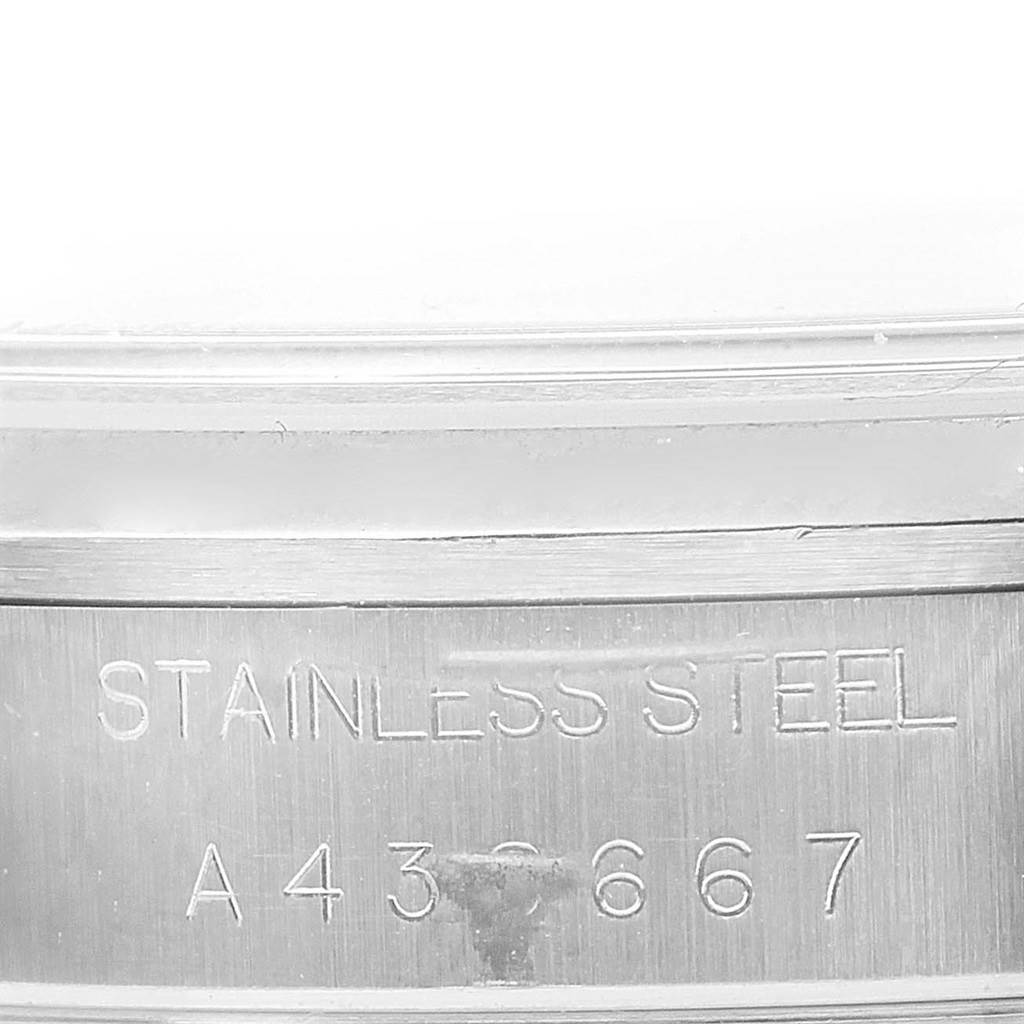 The image shows the engraved text "STAINLESS STEEL A 436667" on a part of the watch case of a Rolex Air-King 14000 Women's Stainless Steel Blue Dial 14000 Women's Stainless Steel Blue Dial model.
