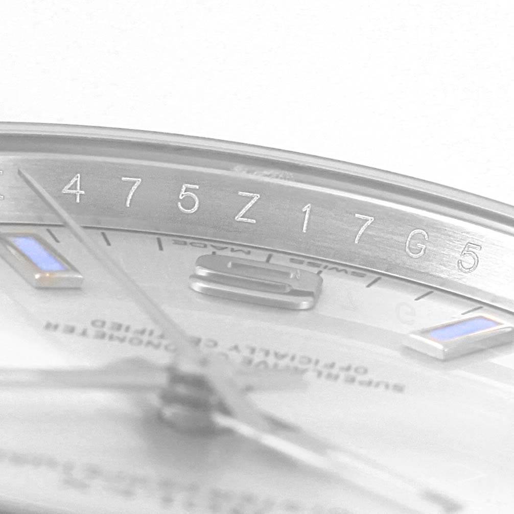 This image shows a close-up of the dial and bezel of a Rolex Air-King 114200 Men's Stainless Steel Silver Dial 114200 Men's Stainless Steel Silver Dial watch, highlighting the hour markers and the engraved serial numbers.