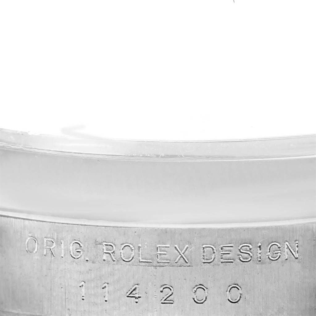The image shows a close-up of the Air-King Rolex watch case back, displaying its engraved model number and design mention.