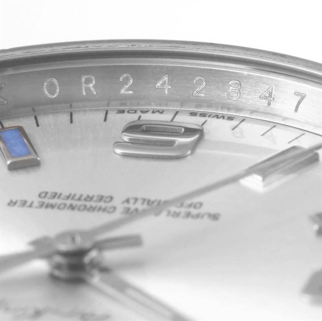 The image shows a close-up angle of the dial and part of the bezel of the Rolex Air-King 114200 Men's Stainless Steel Silver Dial 114200 Men's Stainless Steel Silver Dial watch, highlighting the serial number.