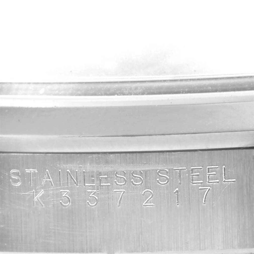 This image shows a close-up of the stainless steel casing with engraved lettering of a Rolex Air-King 14000 Men's Stainless Steel Black Dial 14000 Men's Stainless Steel Black Dial watch.