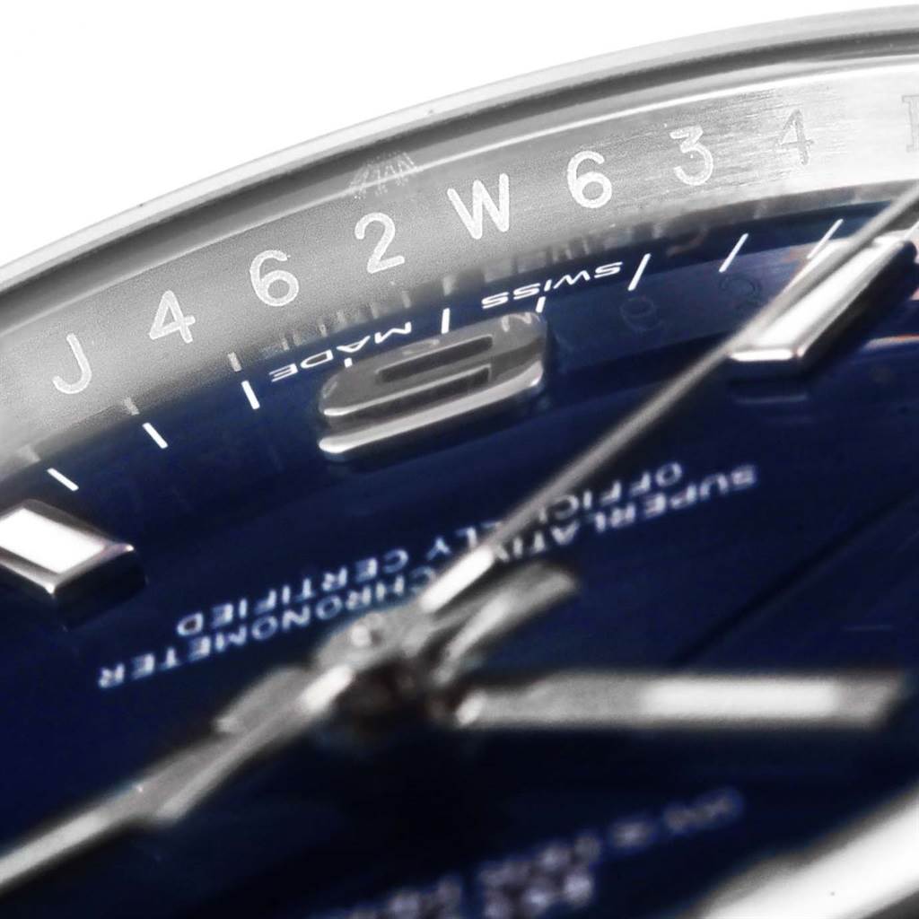 This close-up angle of the Rolex Air-King 114200 Men's Stainless Steel Blue Dial 114200 Men's Stainless Steel Blue Dial watch showcases the dial, hands, and partial numbering around the edge.