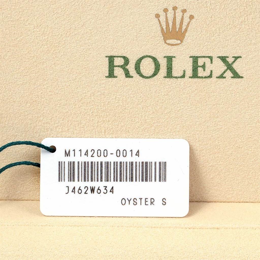 The image shows a tag with detailed information for a Rolex Air-King 114200 Men's Stainless Steel Blue Dial 114200 Men's Stainless Steel Blue Dial model, including a barcode and serial number.