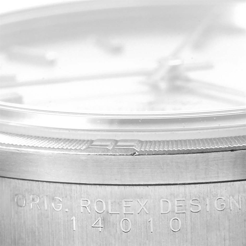 The image shows a close-up view of the case edge and bezel of the Rolex Air-King 14010 Men's Stainless Steel Silver Dial 14010 Men's Stainless Steel Silver Dial watch model, revealing the inscription and partial dial.