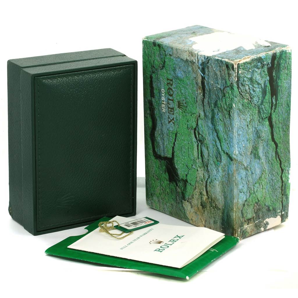 The image shows the packaging of a Rolex Air-King 14010 Men's Stainless Steel Silver Dial 14010 Men's Stainless Steel Silver Dial watch, including a green watch box, outer box, and printed booklets.