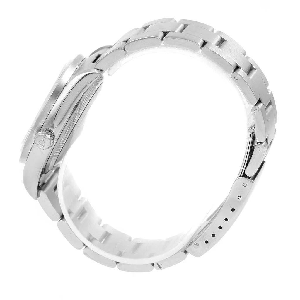 The image shows a side view of a Rolex Air-King 14010 Men's Stainless Steel Blue Dial 14010 Men's Stainless Steel Blue Dial watch, highlighting its stainless steel case, crown, and bracelet.