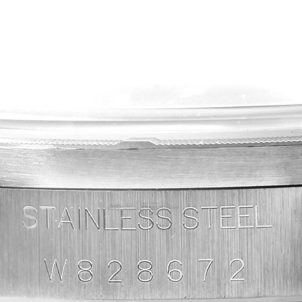 The image shows a close-up of the stainless steel casing and serial number of a Rolex Air-King 14010 Men's Stainless Steel Blue Dial 14010 Men's Stainless Steel Blue Dial watch.