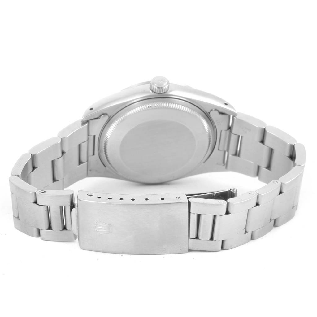 The image shows the back view of a Rolex Air-King 14000 Men's Stainless Steel Silver Dial 14000 Men's Stainless Steel Silver Dial watch, including the case back and the bracelet with the clasp open.