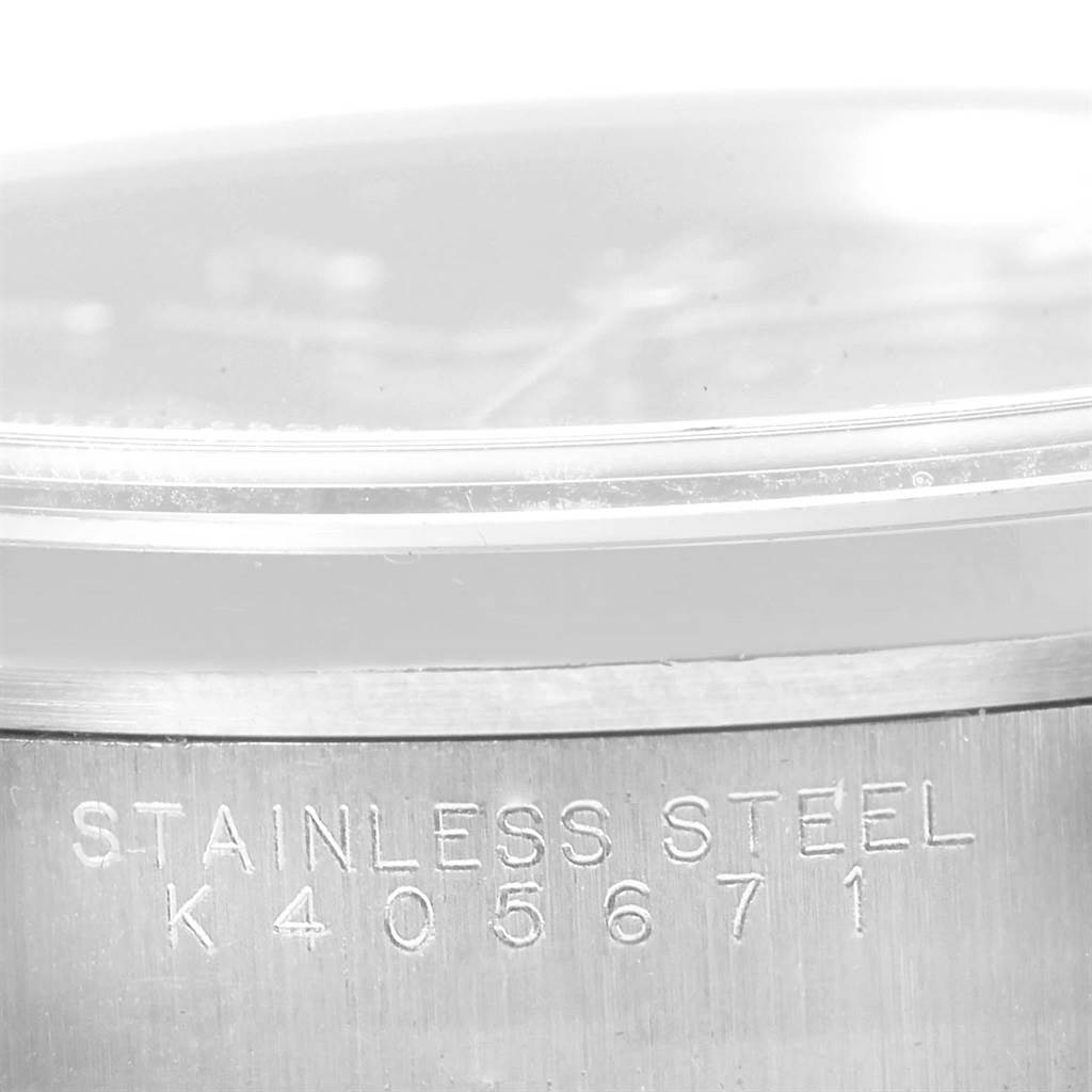 The image shows a close-up of the serial number and "Stainless Steel" inscription on the case back of a Rolex Air-King 14000 Men's Stainless Steel Black Dial 14000 Men's Stainless Steel Black Dial watch.