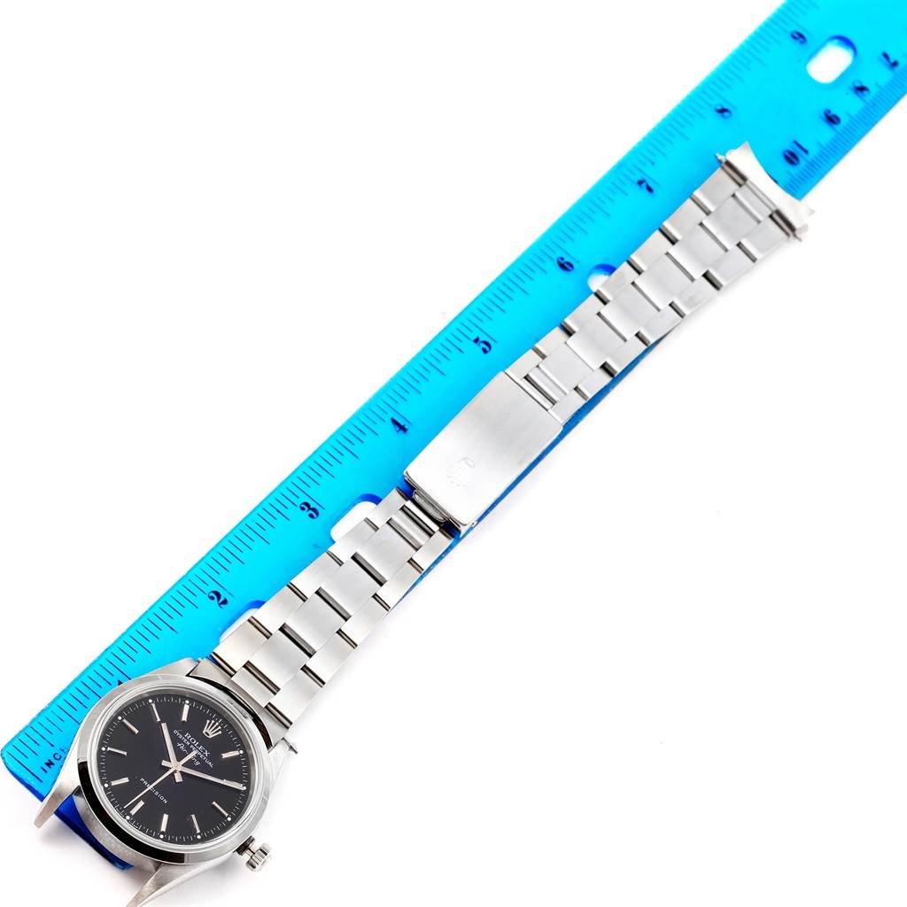 The image shows a Rolex Air-King 14000 Men's Stainless Steel Black Dial 14000 Men's Stainless Steel Black Dial watch laid flat next to a ruler, displaying the face and bracelet in profile view.