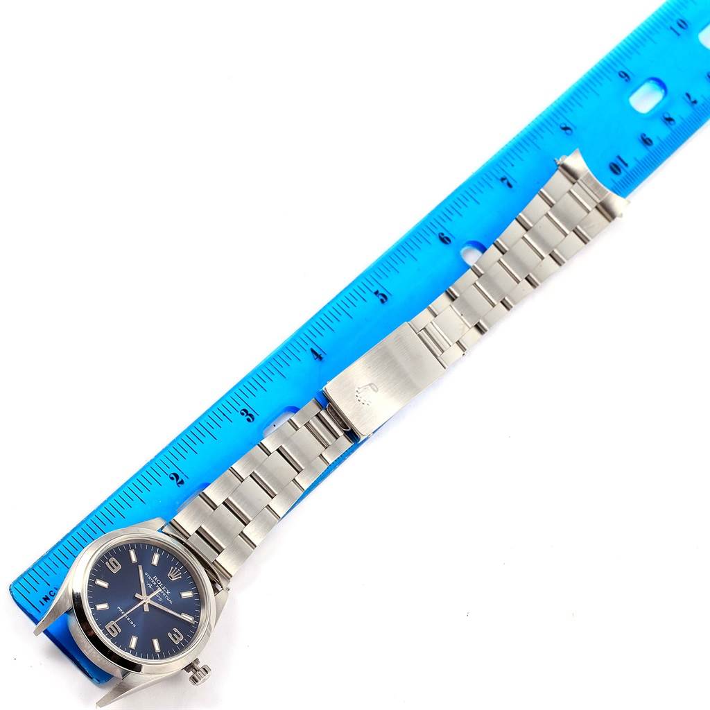 The image shows a Rolex Air-King 14000 Men's Stainless Steel Blue Dial 14000 Men's Stainless Steel Blue Dial watch and its bracelet laid flat with a blue ruler for scale.