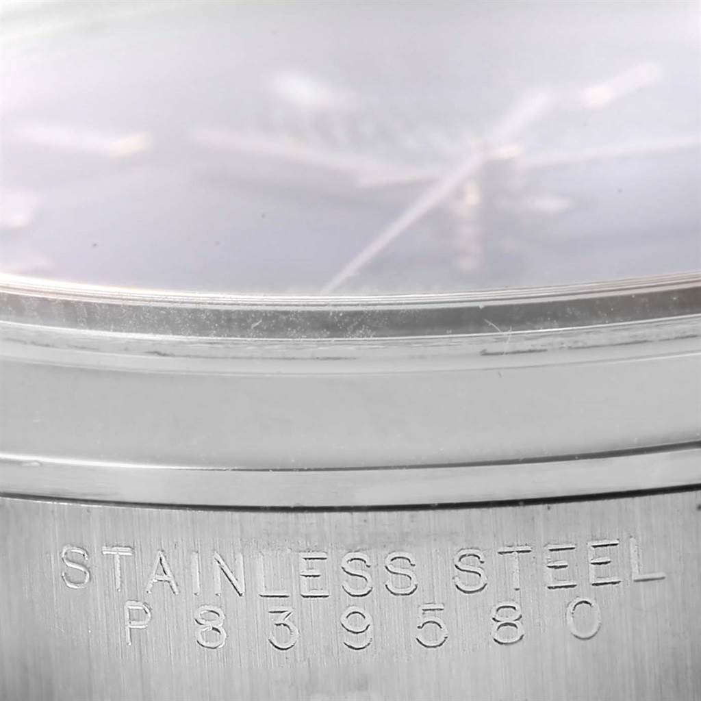 This image shows a close-up of the Rolex Air-King 14000 Men's Stainless Steel Blue Dial 14000 Men's Stainless Steel Blue Dial watch's side, displaying the edge of the dial and the serial number.