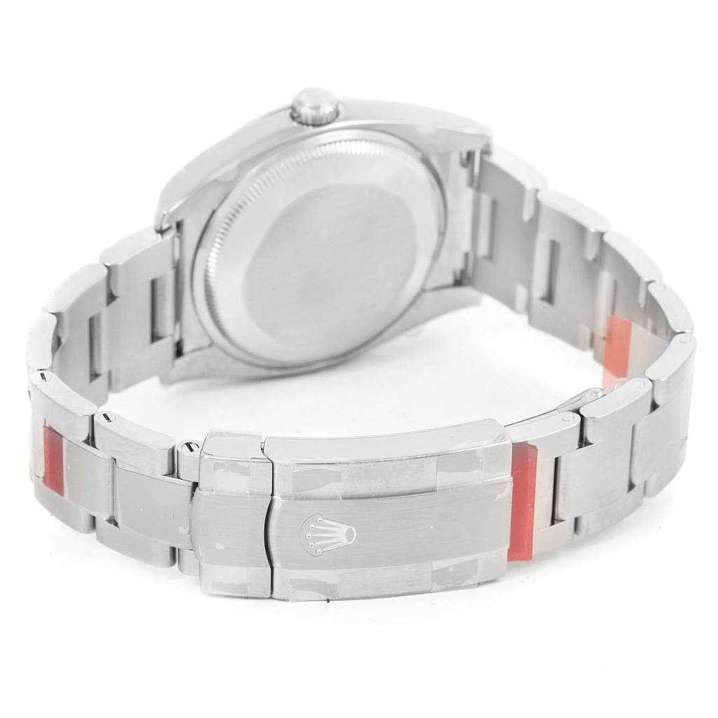 The image shows the back view of a Rolex Air-King 114200 Men's Stainless Steel Blue Dial 114200 Men's Stainless Steel Blue Dial watch, focusing on the case back and the clasp of the bracelet.