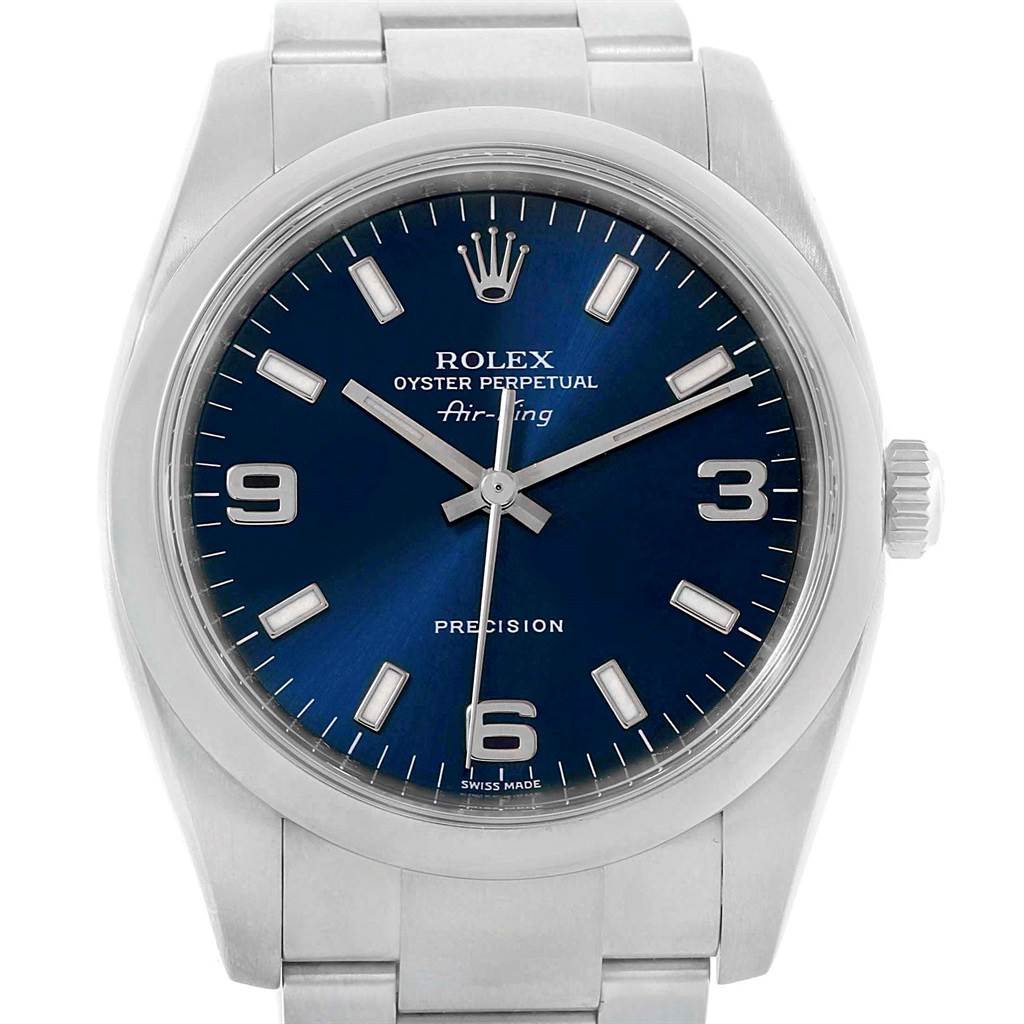 The image shows a frontal view of a Rolex Air-King 114200 Men's Stainless Steel Blue Dial 114200 Men's Stainless Steel Blue Dial watch, highlighting the dial, hour markers, hands, crown, and part of the bracelet.