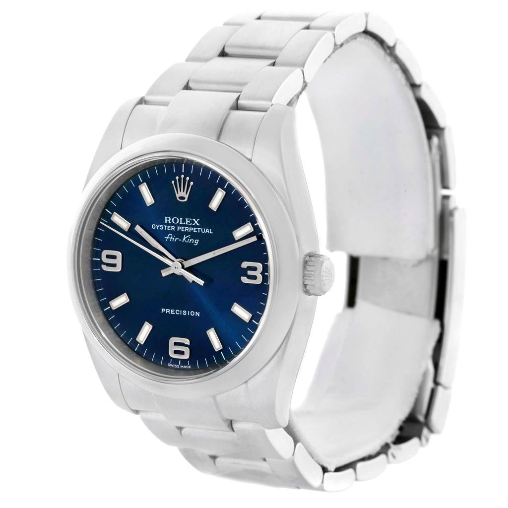 The Rolex Air-King 114200 Men's Stainless Steel Blue Dial 114200 Men's Stainless Steel Blue Dial watch is shown at a slight angle, displaying the face, crown, and part of the bracelet.