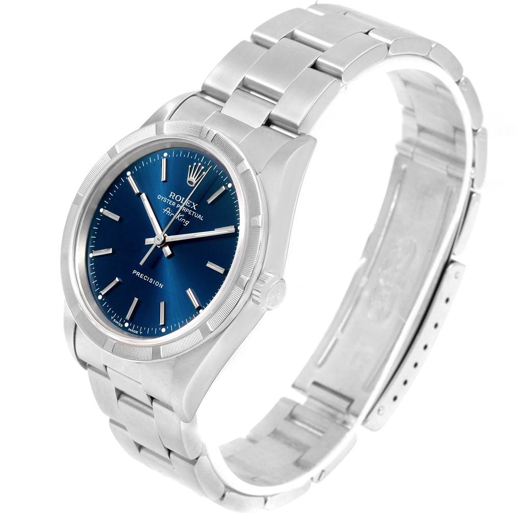 The Rolex Air-King 14010 Men's Stainless Steel Blue Dial 14010 Men's Stainless Steel Blue Dial watch is shown from a slightly elevated side angle, revealing its blue dial, bezel, case, and metal bracelet.