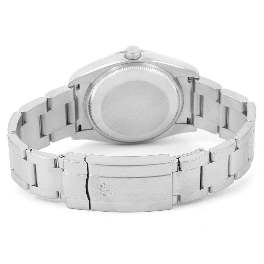 This image shows the back case and bracelet of the Rolex Air-King 114200 Men's Stainless Steel Blue Dial 114200 Men's Stainless Steel Blue Dial watch, including the clasp with the Rolex logo.