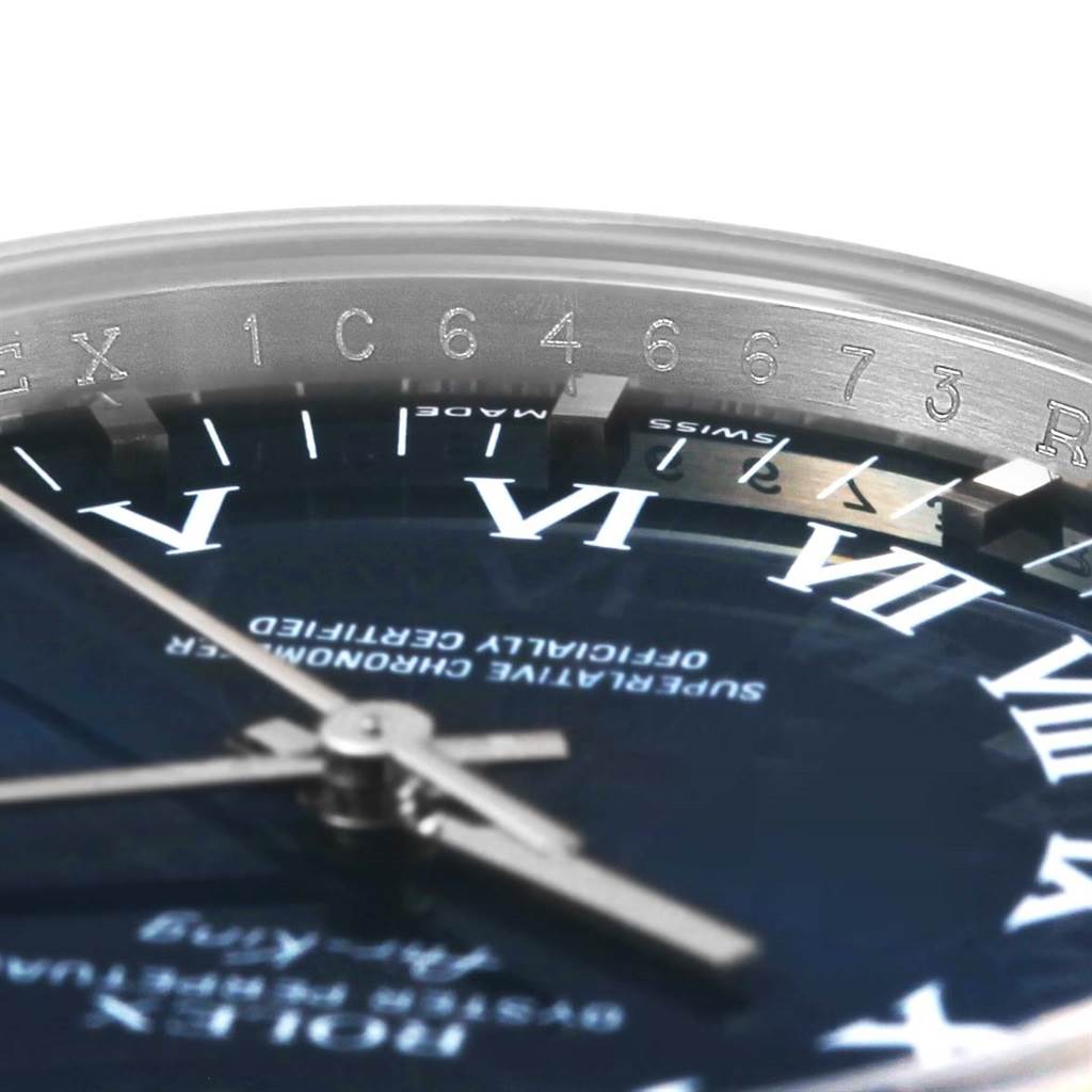 The image shows a close-up angled view of the Rolex Air-King 114200 Men's Stainless Steel Blue Dial 114200 Men's Stainless Steel Blue Dial watch, featuring the dial, hands, and part of the bezel with engraved numbers.