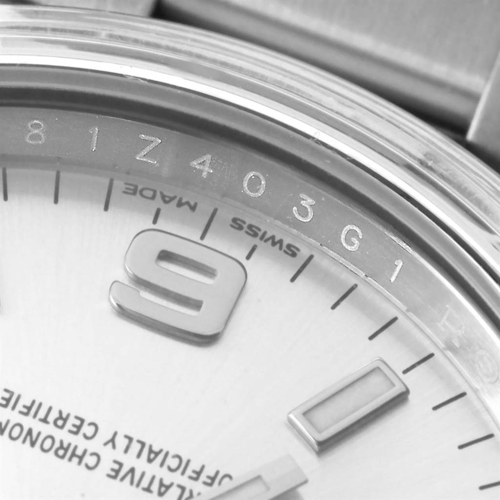 The image shows a close-up of the dial of a Rolex Air-King 114200 Men's Stainless Steel Silver Dial 114200 Men's Stainless Steel Silver Dial watch, highlighting the "9" numeral, minute markers, and part of the serial number.