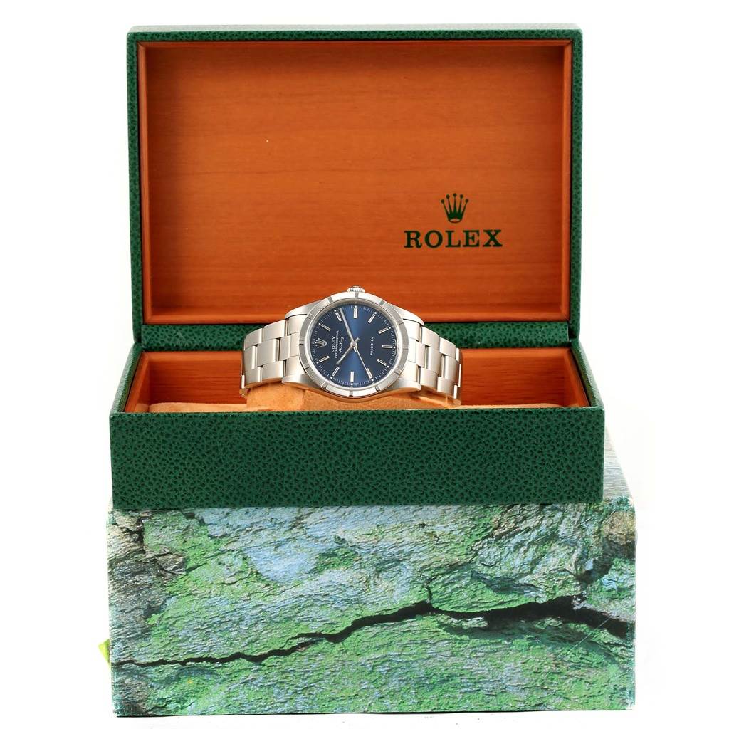 The image shows a Rolex Air-King 14010 Men's Stainless Steel Blue Dial 14010 Men's Stainless Steel Blue Dial watch inside its open green and wooden box, viewed from the front.