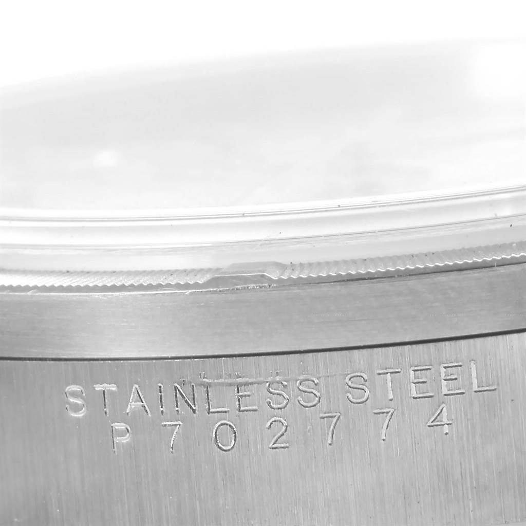 The image shows a close-up of the case back of a Rolex Air-King 14010 Men's Stainless Steel Silver Dial 14010 Men's Stainless Steel Silver Dial model with "Stainless Steel" and a serial number engraved.