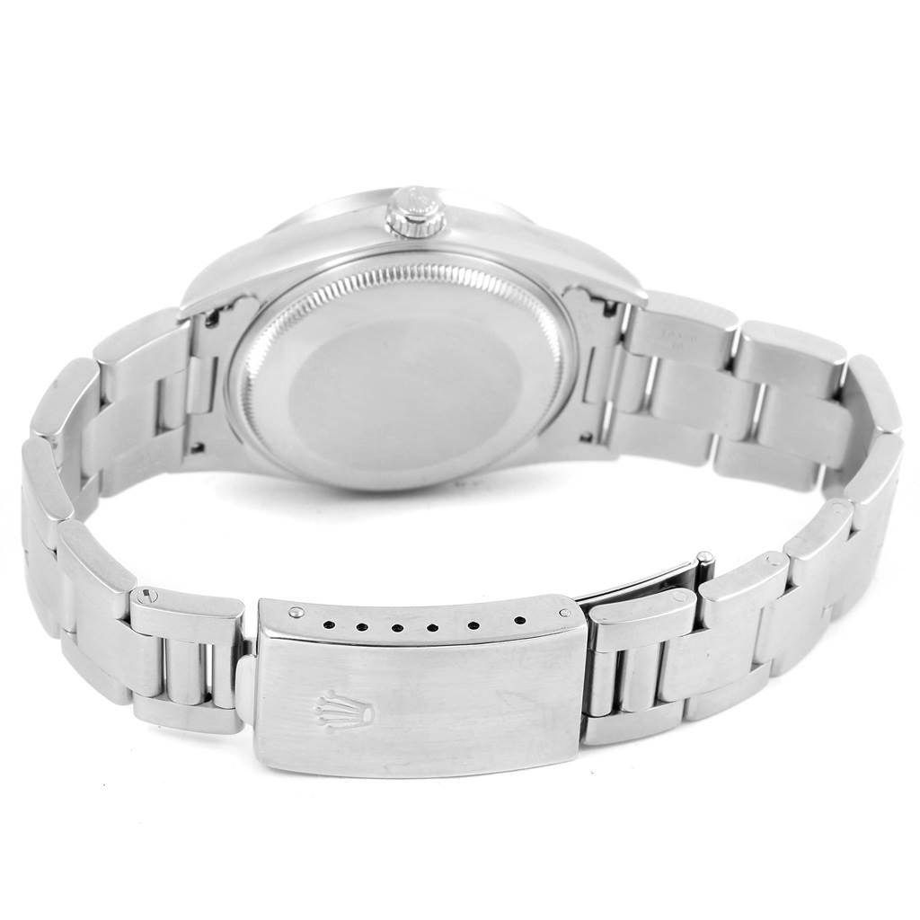 This image shows the backside of a Rolex Air-King 14010 Men's Stainless Steel Silver Dial 14010 Men's Stainless Steel Silver Dial watch, highlighting the case back, bracelet, and clasp.