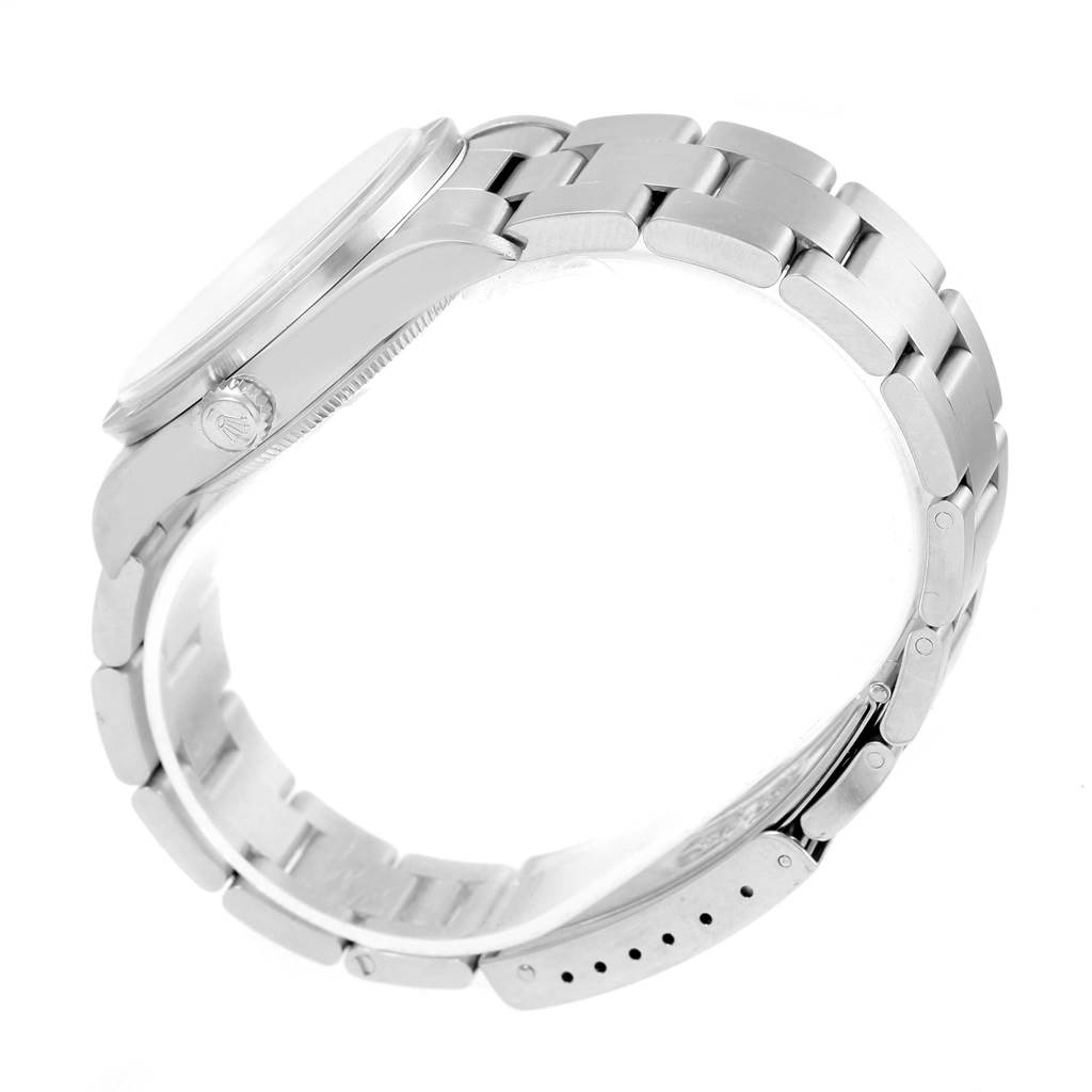 This image shows a side view of a Rolex Air-King 14010 Men's Stainless Steel Silver Dial 14010 Men's Stainless Steel Silver Dial watch, highlighting its metal bracelet and crown.