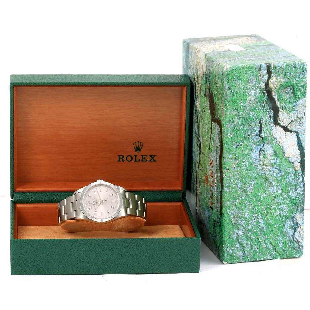 The image shows a Rolex Air-King 14010 Men's Stainless Steel Silver Dial 14010 Men's Stainless Steel Silver Dial watch in its green open box, with the exterior box next to it.