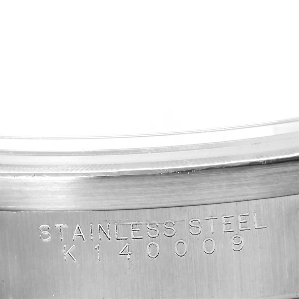 The image shows a close-up of the stainless steel case back of a Rolex Air-King 14010 Men's Stainless Steel Silver Dial 14010 Men's Stainless Steel Silver Dial watch with a serial number.