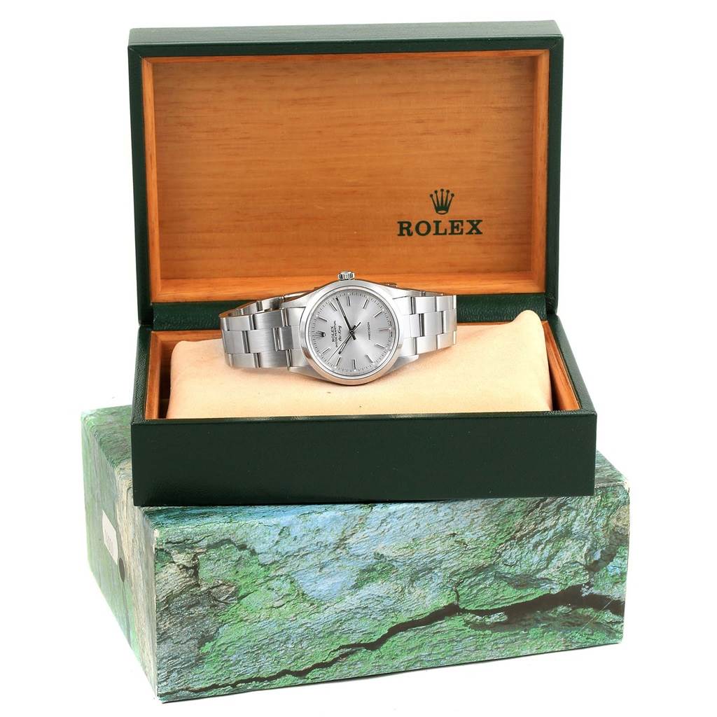 The Rolex Air-King 14000 Men's Stainless Steel Silver Dial 14000 Men's Stainless Steel Silver Dial watch is shown in a front view, resting in an open Rolex box on a cushion.