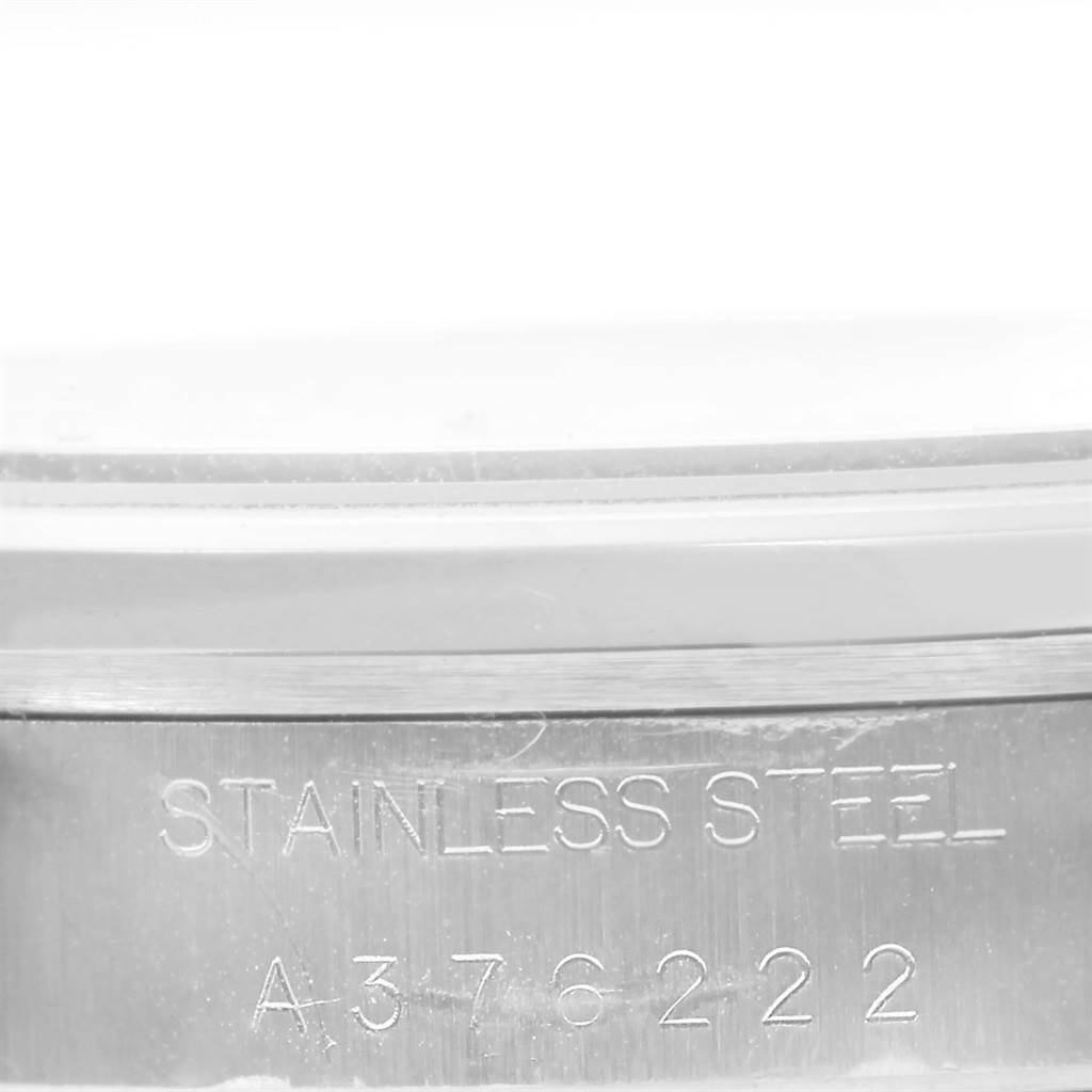 The image shows a close-up of the engraving on the stainless steel case of a Rolex Air-King 14000 Men's Stainless Steel Silver Dial 14000 Men's Stainless Steel Silver Dial watch.