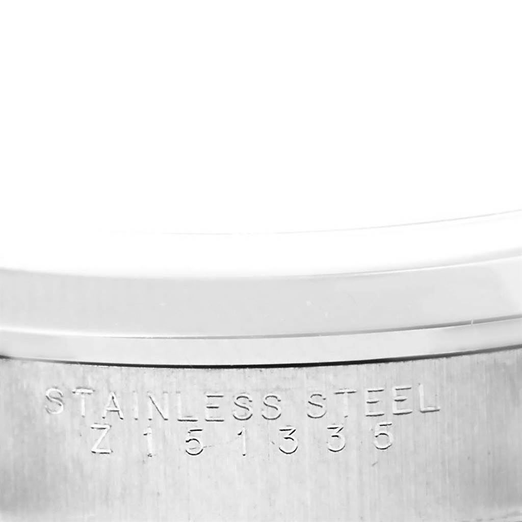 The image shows a close-up of the stainless steel case back with serial number etching of a Rolex Air-King 14000 Men's Stainless Steel Blue Dial 14000 Men's Stainless Steel Blue Dial watch.