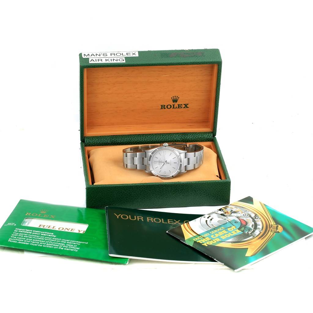 The image displays a Rolex Air-King 14010 Men's Stainless Steel Silver Dial 14010 Men's Stainless Steel Silver Dial watch in its open box with accompanying booklets laid out in front.
