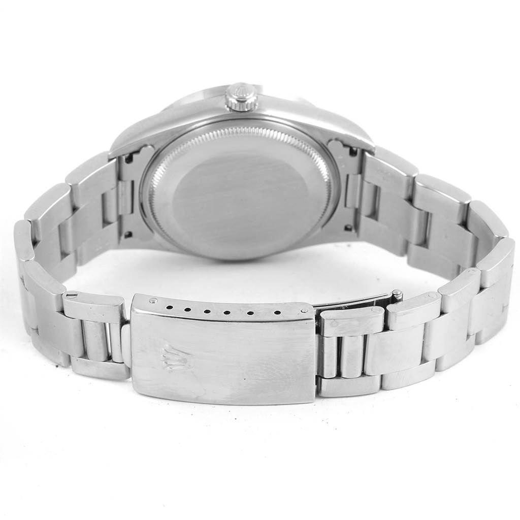 This image shows the backside, clasp, and bracelet of a Rolex Air-King 14010 Men's Stainless Steel Silver Dial 14010 Men's Stainless Steel Silver Dial watch.