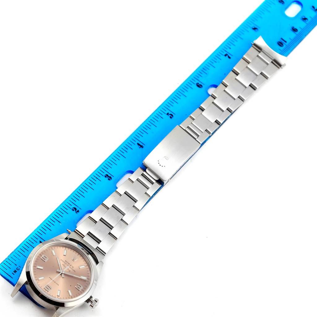 The image shows a Rolex Air-King 14000 Stainless Steel Pink Dial 14000 Stainless Steel Pink Dial watch laid flat with its face, bracelet, and clasp visible, alongside a blue ruler for scale.