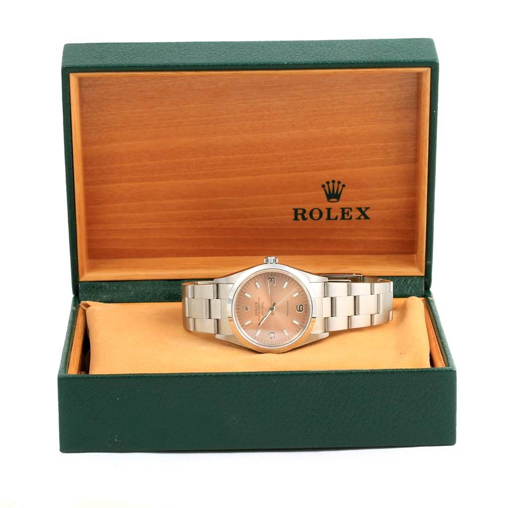 This image shows a Rolex Air-King 14000 Stainless Steel Pink Dial 14000 Stainless Steel Pink Dial watch at a front angle, positioned inside its open green and wooden display box.