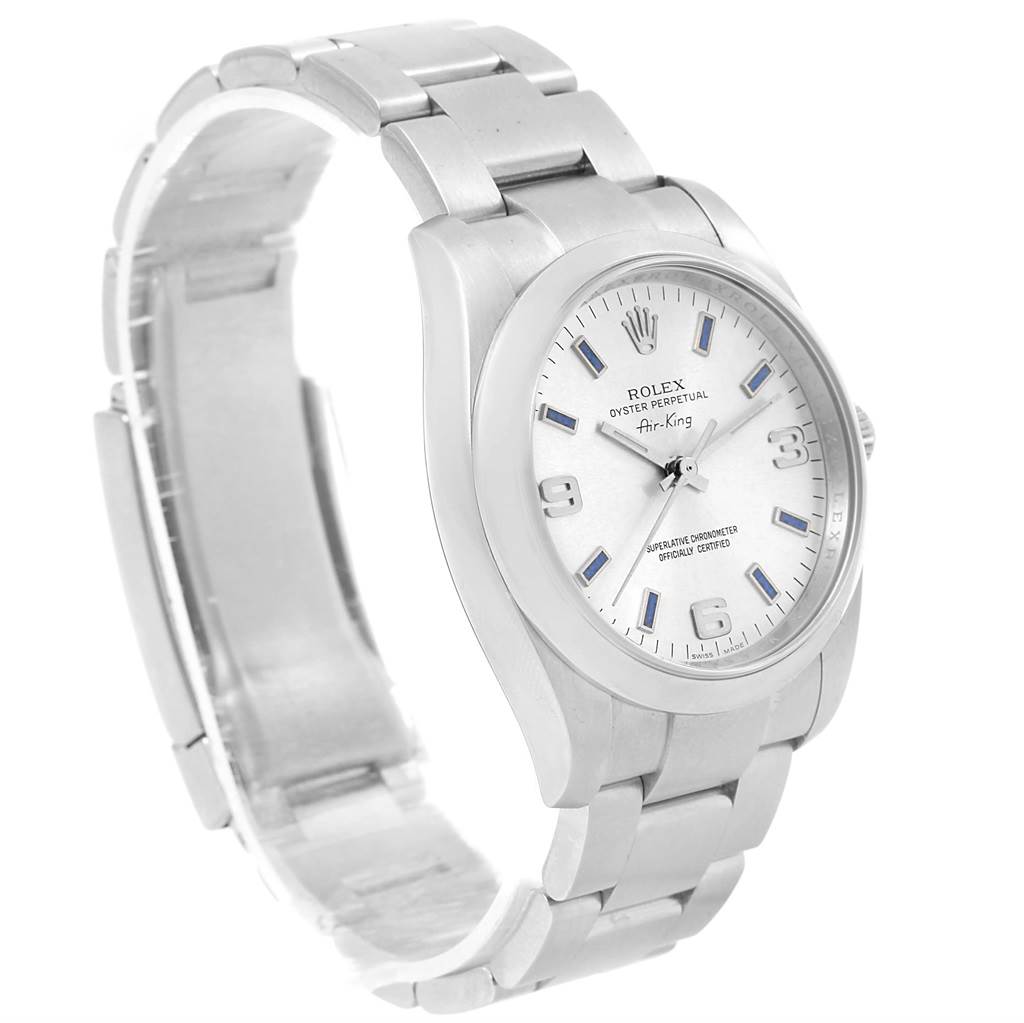 The Rolex Air-King 114200 Men's Stainless Steel Silver Dial 114200 Men's Stainless Steel Silver Dial watch is shown at a three-quarter angle, displaying the face, bracelet, and side profile of the case.