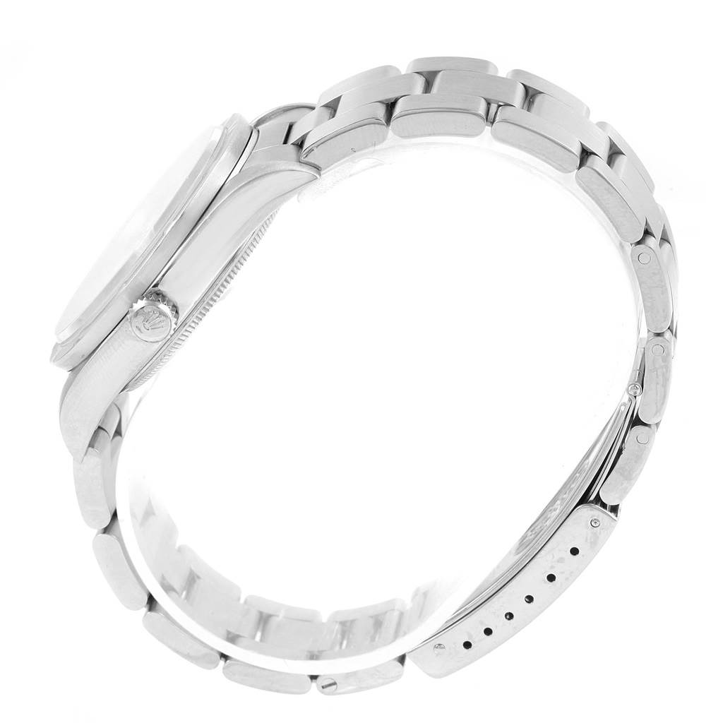 The image shows a side view of a Rolex Air-King 14010 Men's Stainless Steel White Dial 14010 Men's Stainless Steel White Dial watch, highlighting the crown, case, and part of the bracelet.