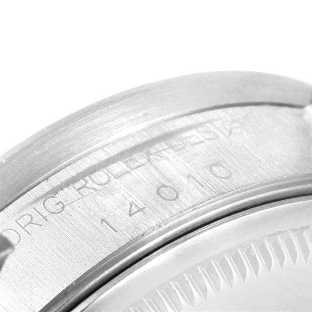 This image shows a close-up of the case back and part of the bezel of the Rolex Air-King 14010 Men's Stainless Steel White Dial 14010 Men's Stainless Steel White Dial watch.