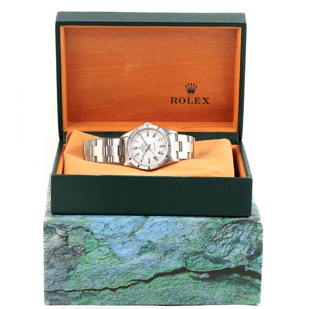 The Rolex Air-King 14010 Men's Stainless Steel White Dial 14010 Men's Stainless Steel White Dial watch is shown front-facing, inside its open green and wood interior Rolex box.