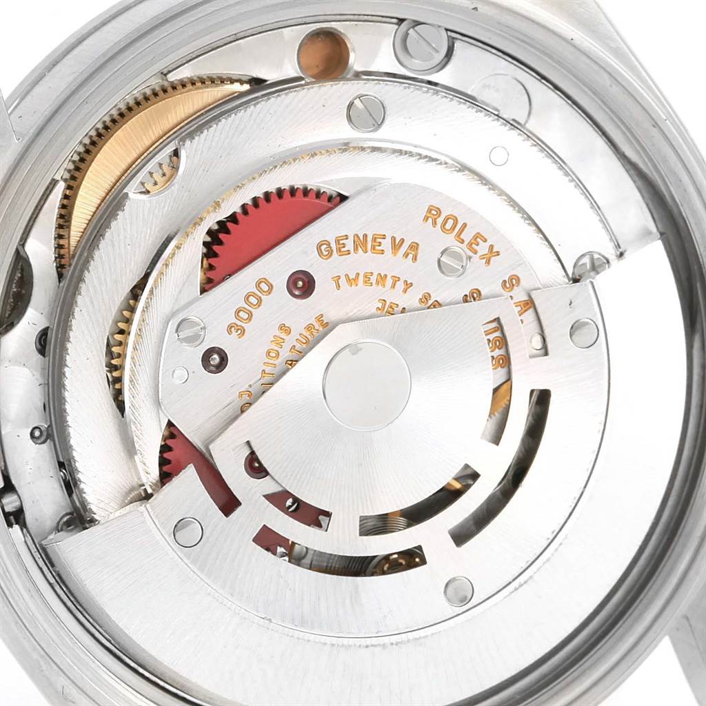 This is an internal view of the Rolex Air-King 14000 Men's Stainless Steel Silver Dial 14000 Men's Stainless Steel Silver Dial watch showing its intricate movement and gears.