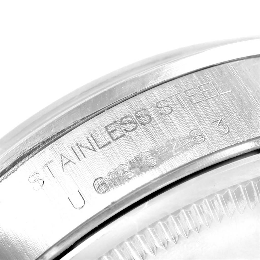 The image shows a close-up of the case back edge of a Rolex Air-King 14000 Men's Stainless Steel Silver Dial 14000 Men's Stainless Steel Silver Dial, focused on the "STAINLESS STEEL" engraving.
