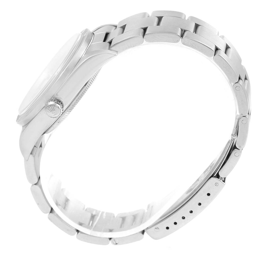 The image shows a side view of a Rolex Air-King 14010 Stainless Steel Pink Dial 14010 Stainless Steel Pink Dial watch, highlighting the crown and the metal bracelet.