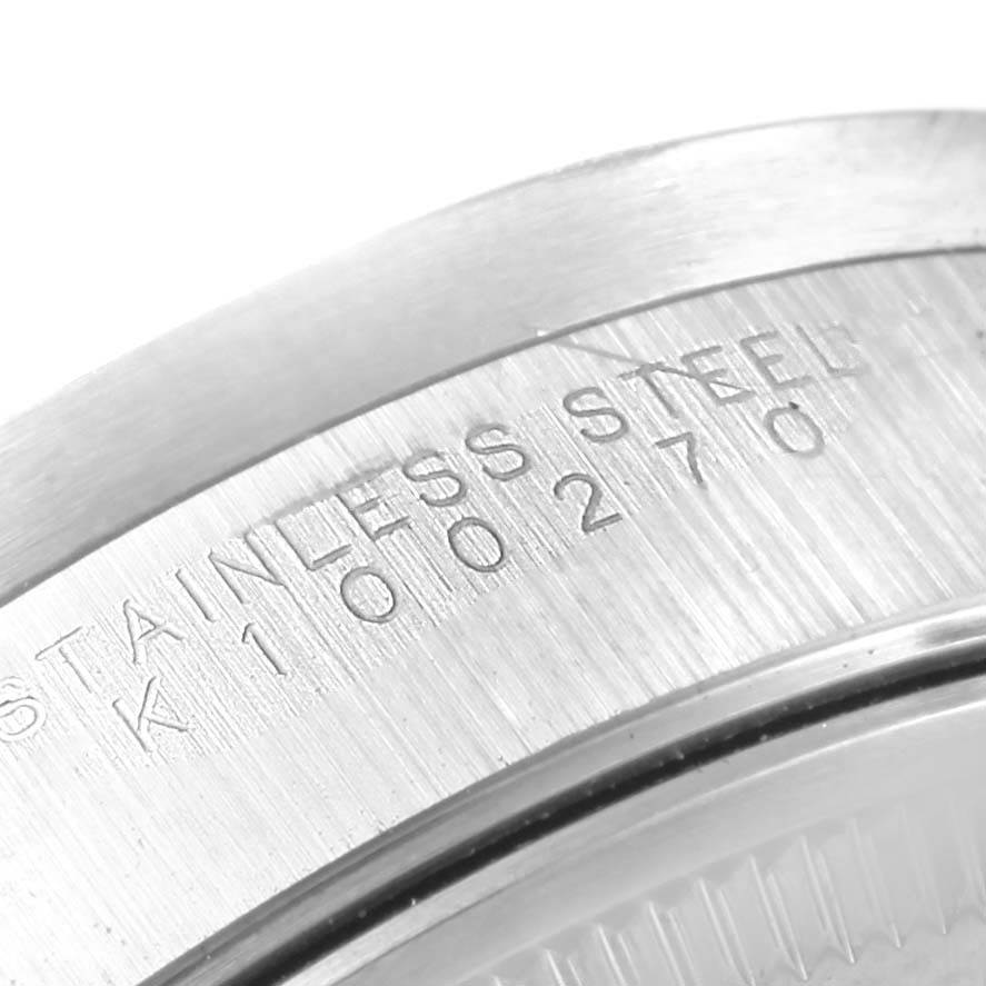This image shows a close-up of the stainless steel case back and serial number of a Rolex Air-King 14010 Stainless Steel Pink Dial 14010 Stainless Steel Pink Dial watch.