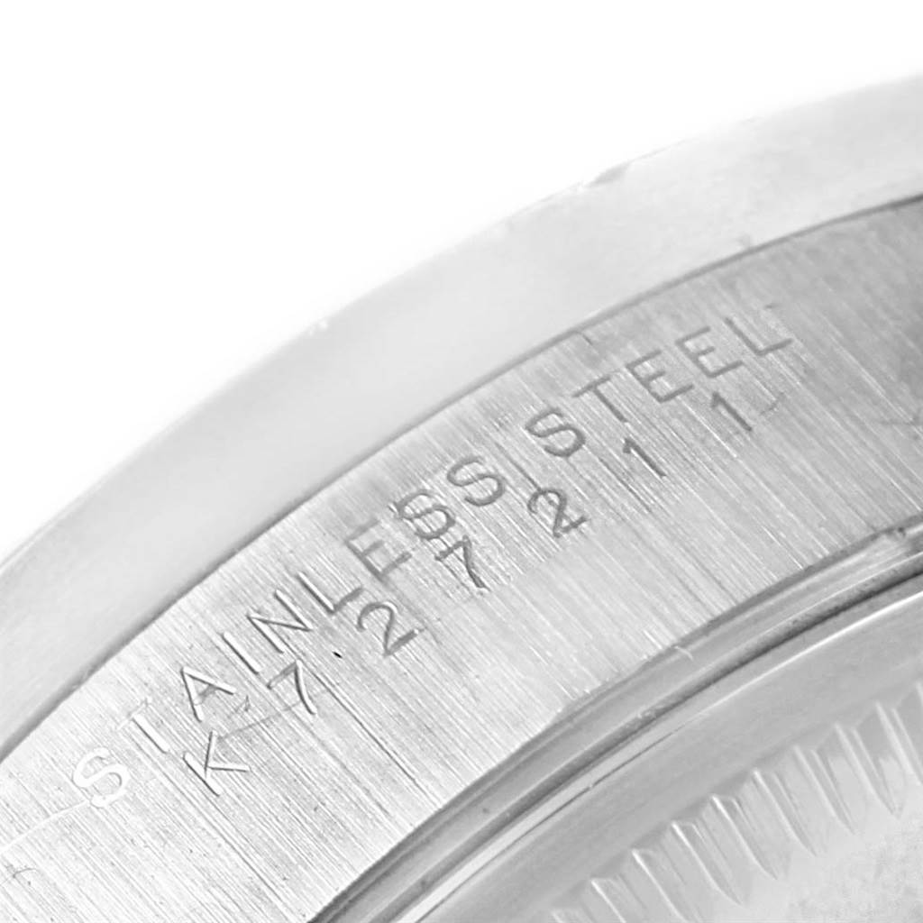 This image shows a close-up of the stainless steel case back of a Rolex Air-King 14010 Men's Stainless Steel Black Dial 14010 Men's Stainless Steel Black Dial watch.