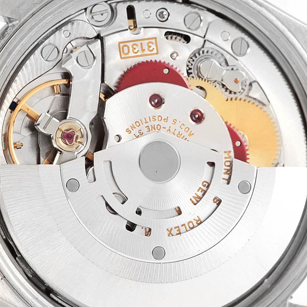 The image shows a close-up view of the internal movement of a Rolex Air-King 14000 Men's Stainless Steel Silver Dial 14000 Men's Stainless Steel Silver Dial watch, focusing on the complex mechanics and cogs.